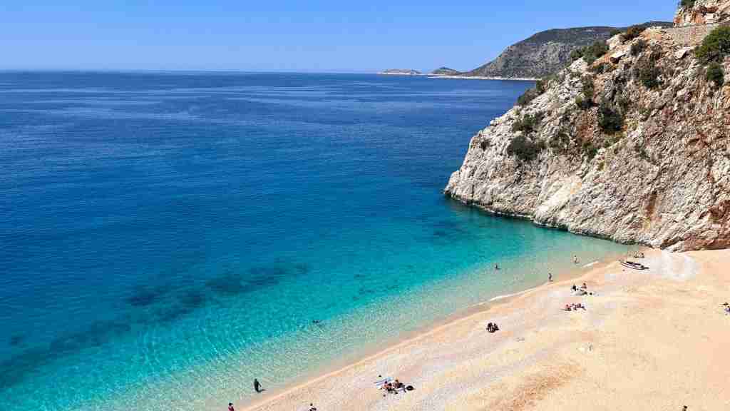 beach blue water sea with mountain hd background