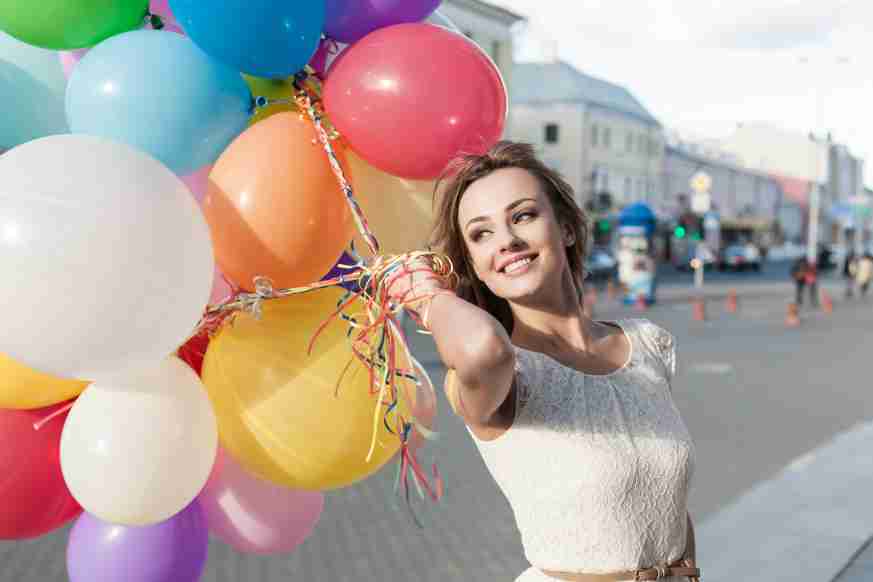 Beautiful girl model happy with balloons