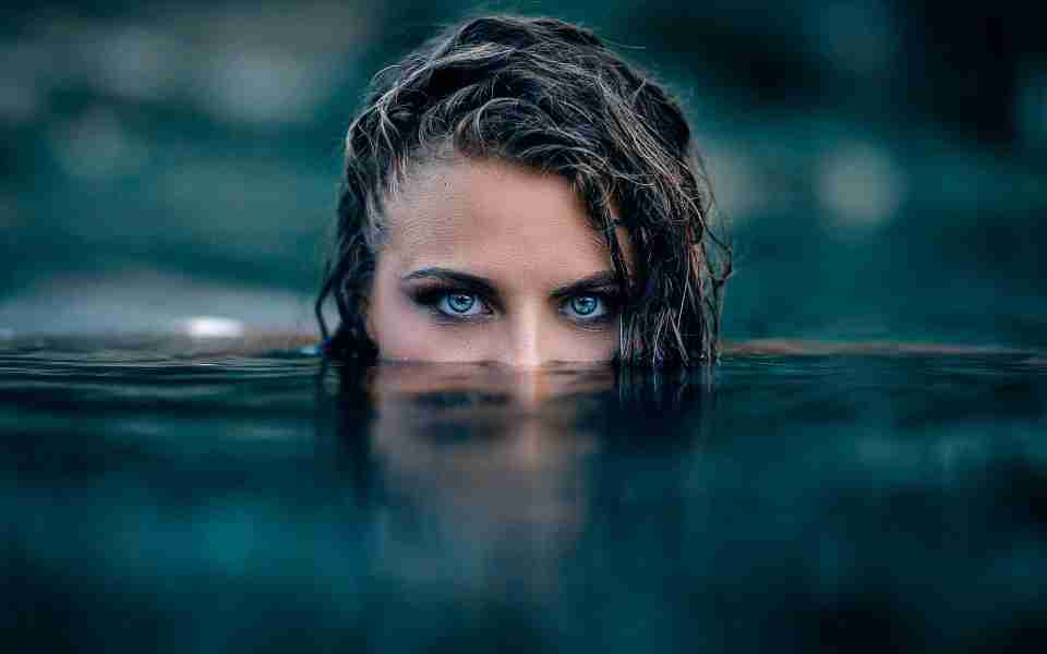 Blue eye girl swimming