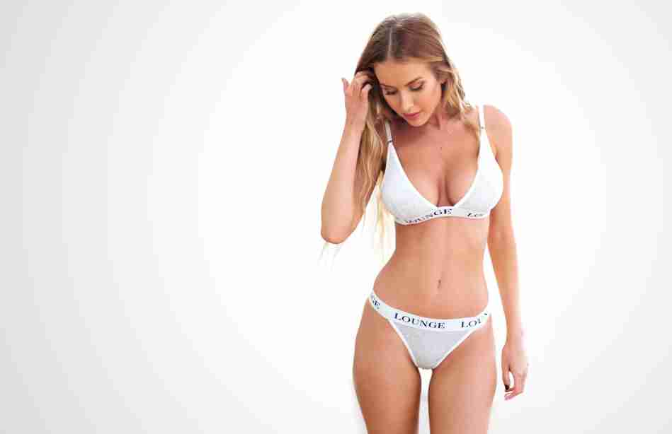 Fitness girl model in white bikini