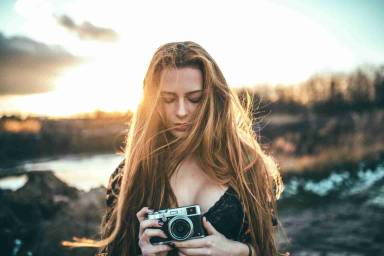 Girl capturing image from camera