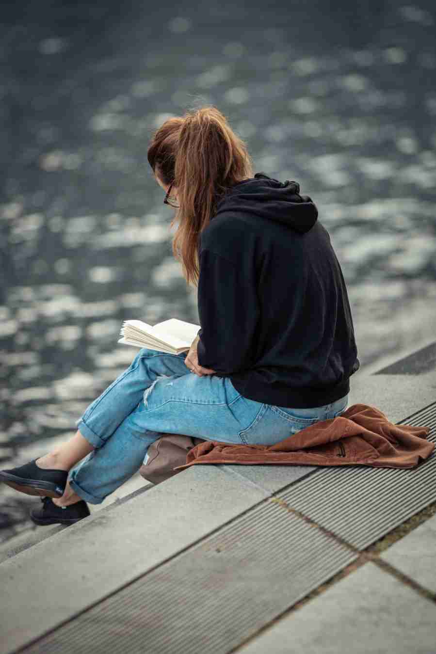 Girl reading book whats app dp