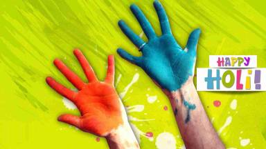Hands with color for greeting happy holi