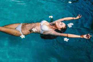 Hot bikini girl swimming in pool