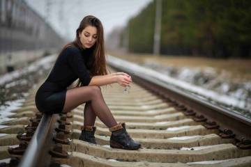 Hot girl pose on rail line